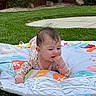 Jenna joined the competition — help win amazing prizes! baby, infant, play_mat, outdoor, grass, curious, child, toddler, clothing, face, hand, head, nature, lawn, garden, colorful, crawling, young, cute, exploring