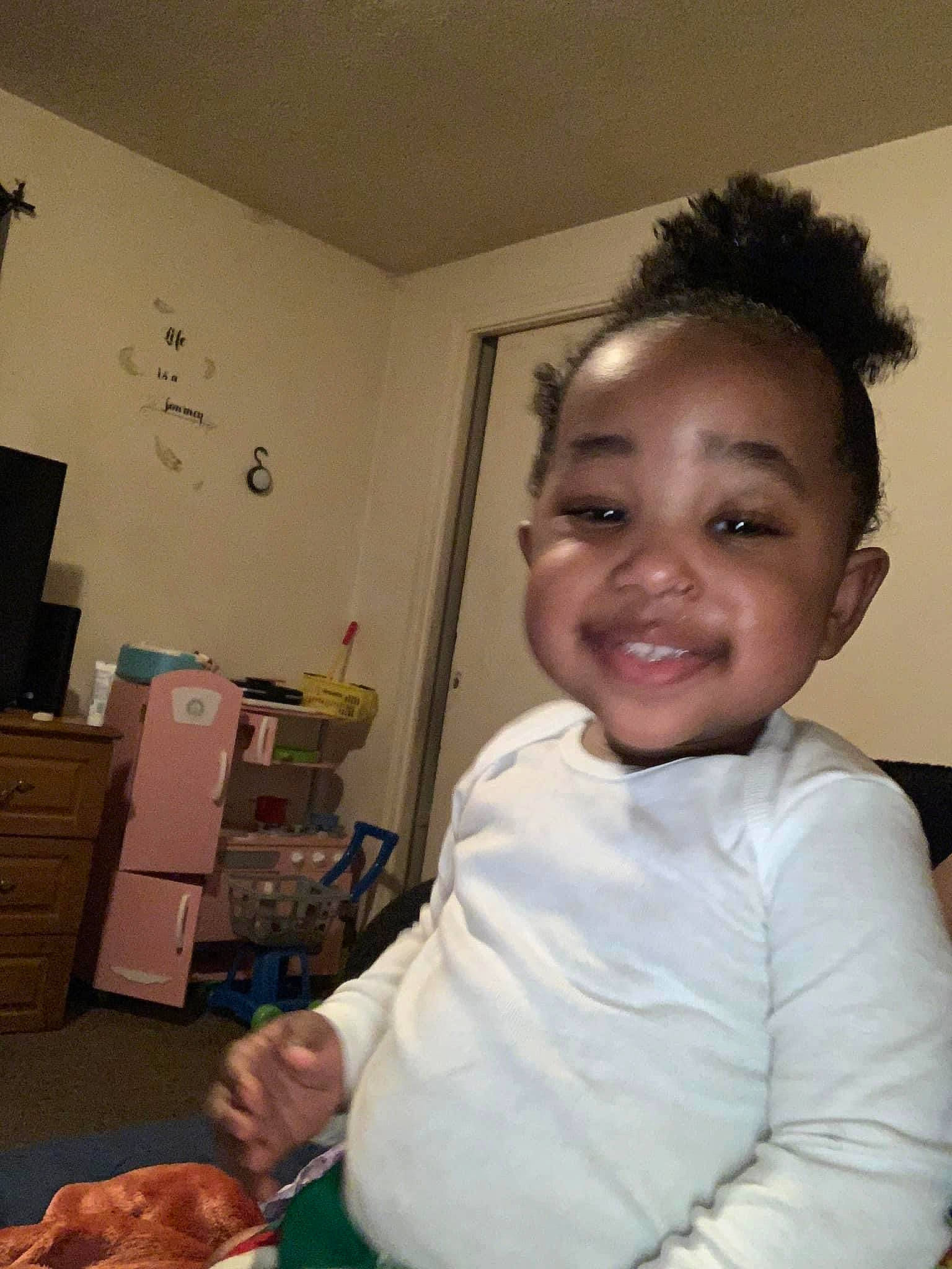 Zinnia is registered to the contest to win money with this photo: cabinetry, chair, child, comfort_food, cook, cooking, food, fun, happy, homemaker, house, joy, kitchen, muscle, person, room, sitting, smile, t_shirt, tableware