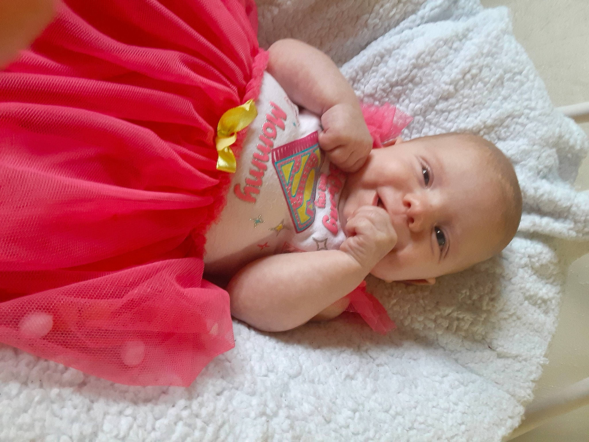 Raina is registered to the contest to win money with this photo: baby, cheek, child, hair_accessory, lip, mouth, person, pink, skin, toddler