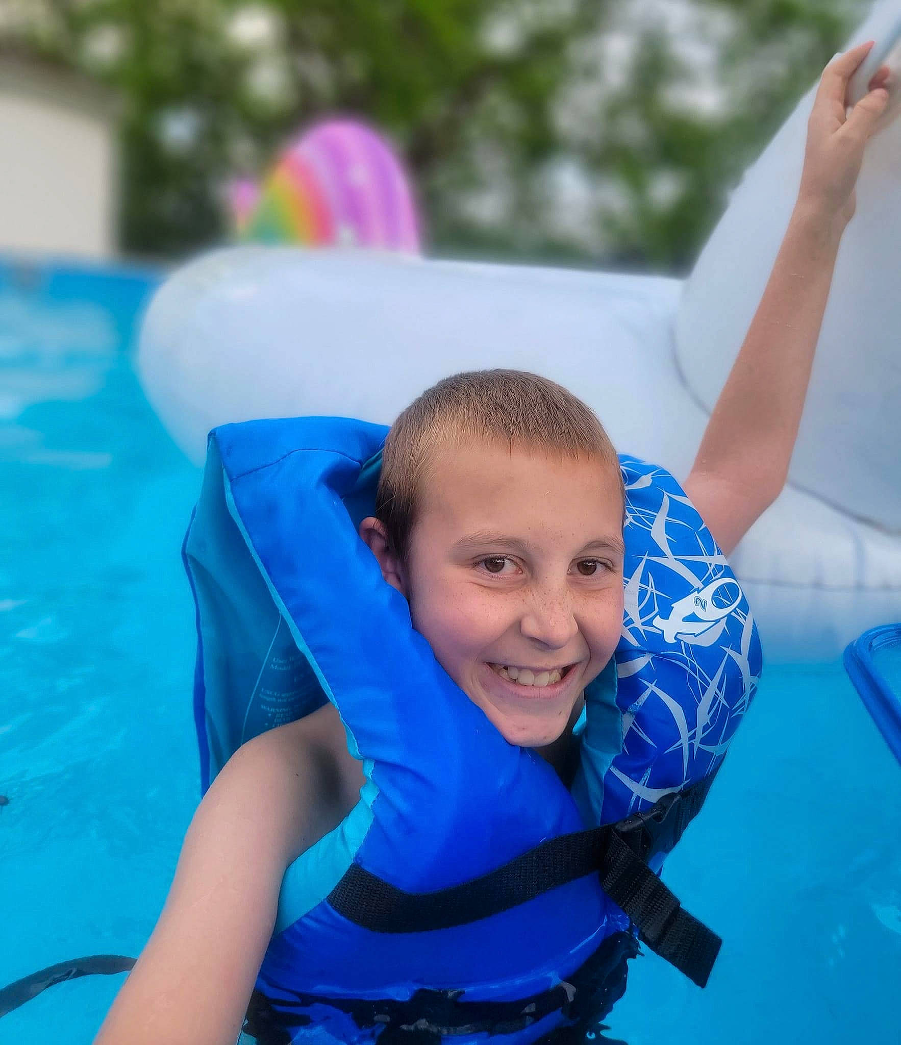 Devin joined the competition — help win amazing prizes! amusement_park, aqua, azure, boats_and_boating_equipment_and_supplies, electric_blue, fun, games, happy, inflatable, joy, leisure, outdoor_recreation, person, personal_protective_equipment, recreation, sitting, smile, sports, swimming_pool, vacation
