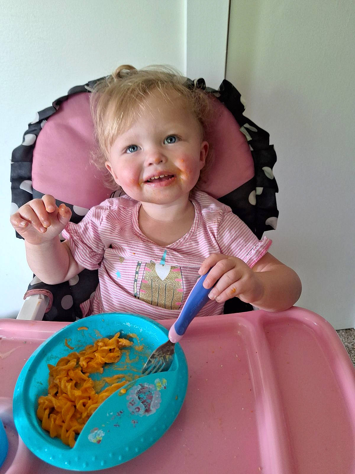 Kairi is registered to the contest to win money with this photo: baby, baby_toddler_clothing, chair, child, cuisine, cutlery, dishware, food, hairstyle, hand, ingredient, joy, kitchen_utensil, person, pink, plate, skin, smile, sweetness, table