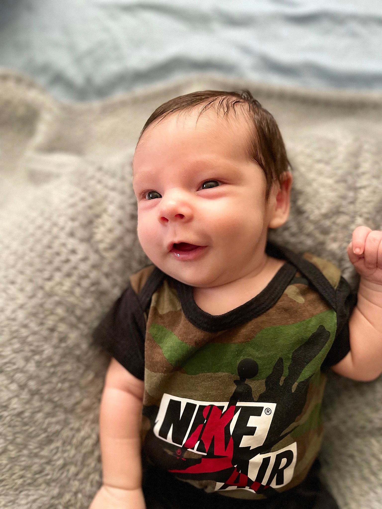 Cashton is registered to the contest to win money with this photo: baby, baby_toddler_clothing, cheek, eye, eyebrow, finger, flash_photography, fun, happy, head, human_body, iris, nose, person, skin, sleeve, smile, t_shirt, toddler, tree