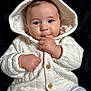 Raphaël participe au concours pour gagner de l'argent avec cette photo : baby, infant, hoodie, white_clothing, cute, face, hand, fingers, portrait, child, warm_clothing, button, sitting, looking, young_child, cozy, soft, closeup, expression, indoor