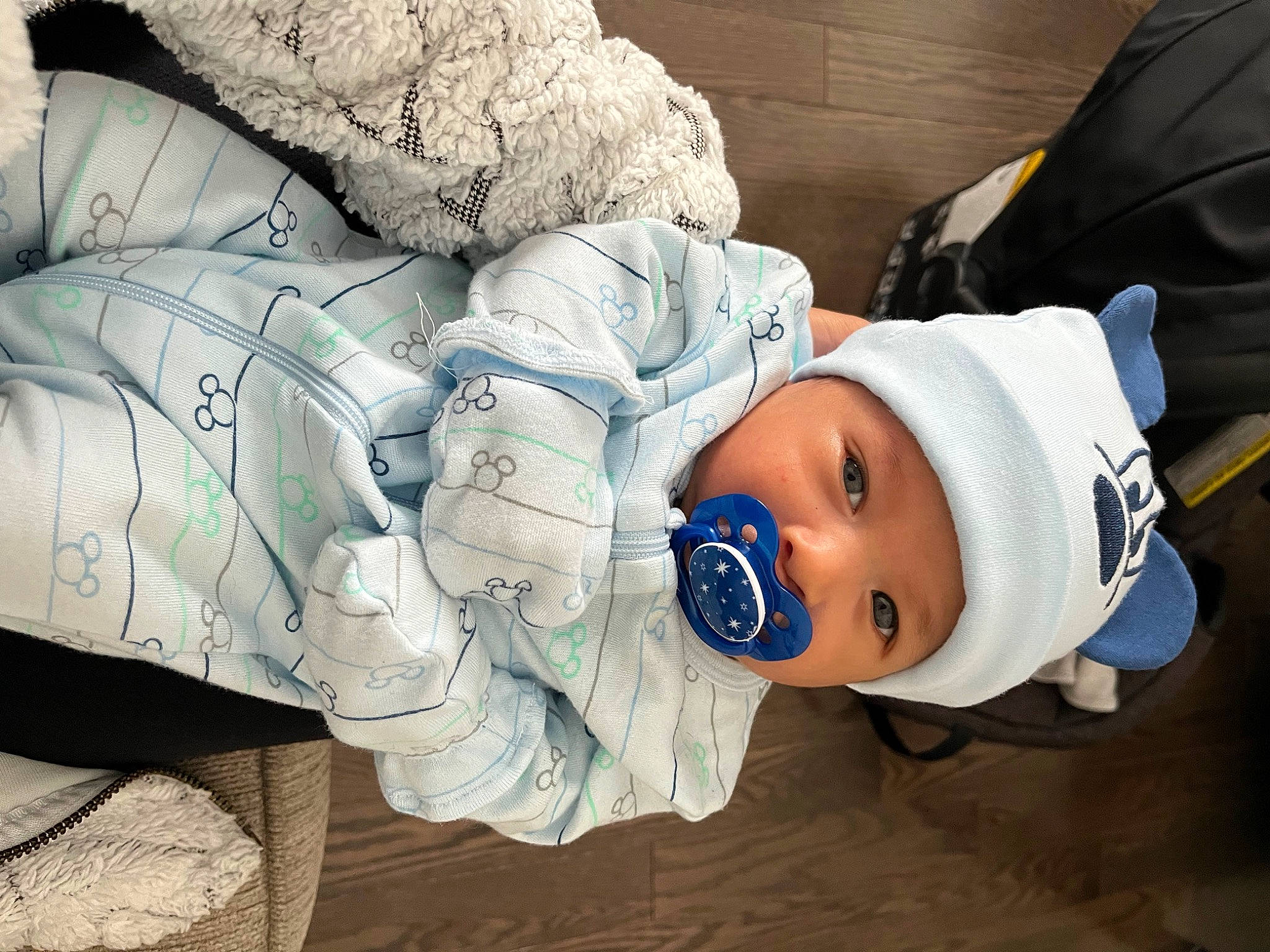 Noah is registered to the contest to win money with this photo: baby, baby_products, baby_sleeping, baby_toddler_clothing, bedding, child, comfort, eye, hat, headwear, linens, nap, person, product, room, sitting, sleep, toddler, tree, winter