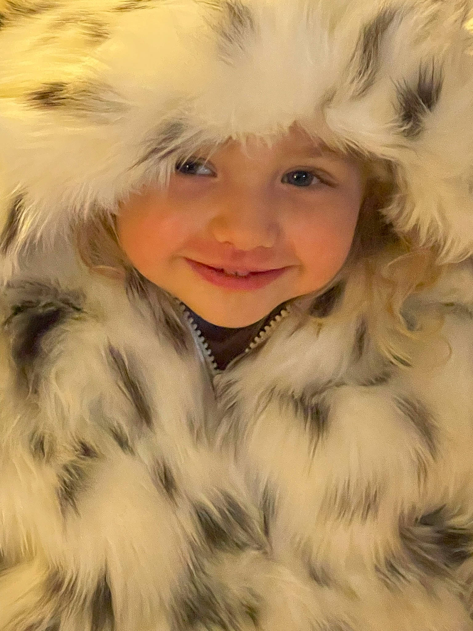 Kayliana is registered to the contest to win money with this photo: animal_product, blond, brown_hair, child, eye, feather, flash_photography, fun, fur, fur_clothing, happy, hat, headwear, iris, jacket, joy, natural_material, outerwear, parka, person