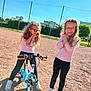 Lya a rejoint le concours — aidez-le/la à gagner de superbes lots ! accessories, bicycle, child, clothing, face, female, footwear, girl, head, machine, outdoors, person, photography, portrait, pushing, shoe, teen, transportation, vehicle, wheel