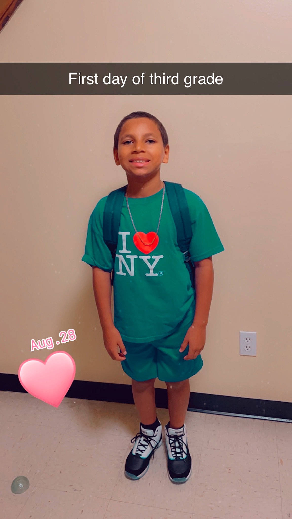 Kevin is registered to the contest to win money with this photo: child, electric_blue, fun, gadget, happy, joint, joy, knee, logo, magenta, neck, person, room, shorts, sleeve, sock, sportswear, standing, t_shirt, thigh