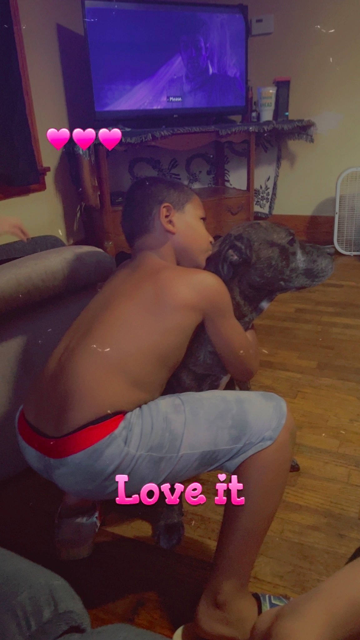 Kevin is registered to the contest to win money with this photo: abdomen, barechested, black_hair, chest, comfort, elbow, event, fun, human_leg, joint, magenta, person, room, sportswear, television, television_set, thigh, thumb, trunk, undergarment