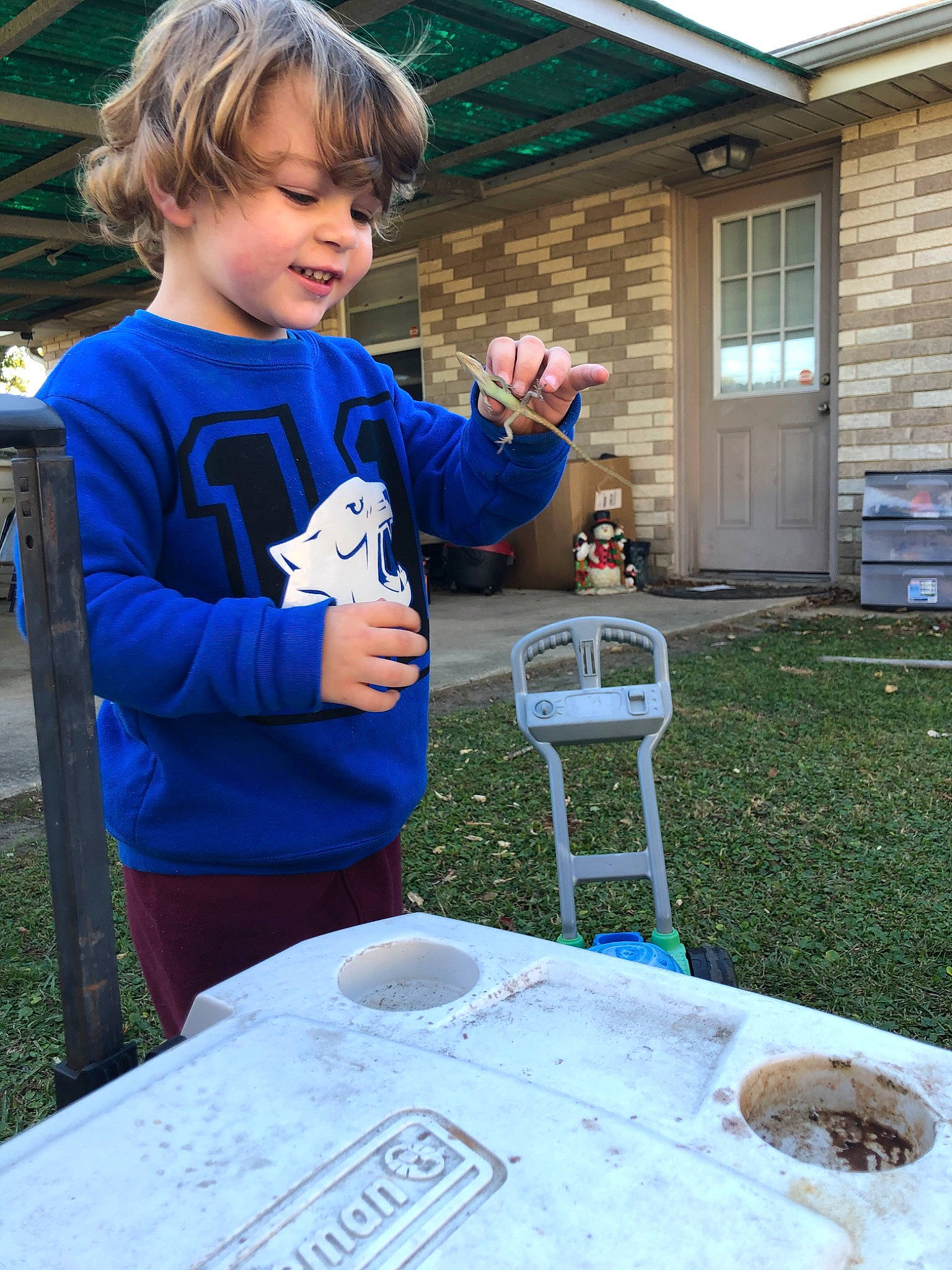 Brandon is registered to the contest to win money with this photo: child, person, play, soil, table, toddler, tree, vacation