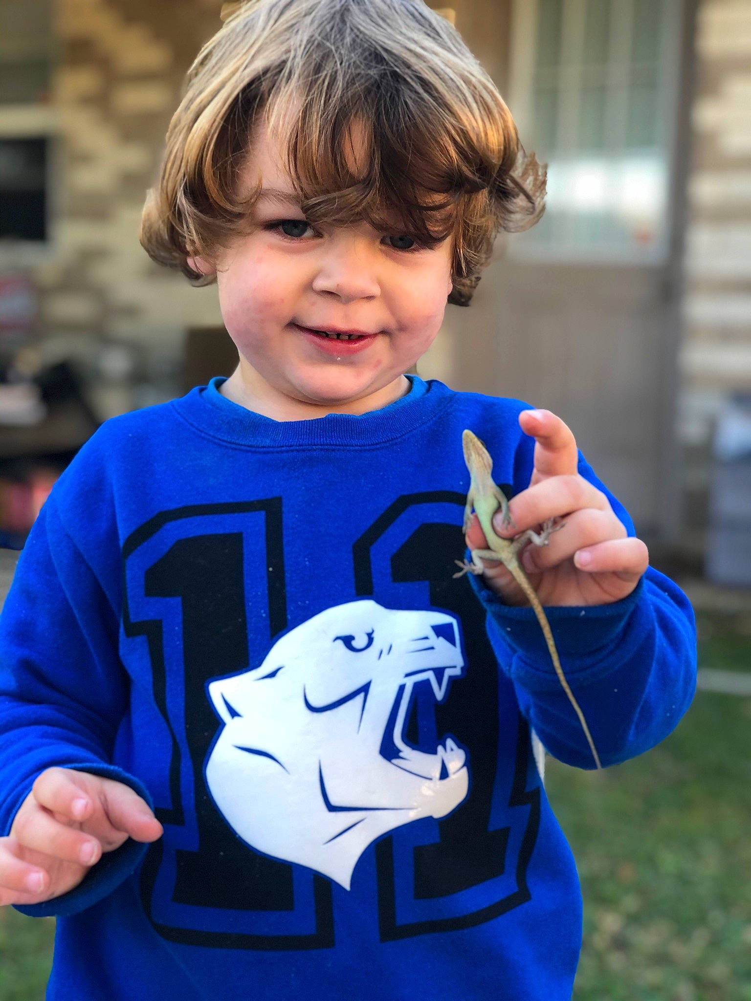 Brandon is registered to the contest to win money with this photo: child, electric_blue, finger, fun, gesture, hand, joy, outerwear, person, play, smile, t_shirt, thumb, thumbs_signal, toddler, tooth