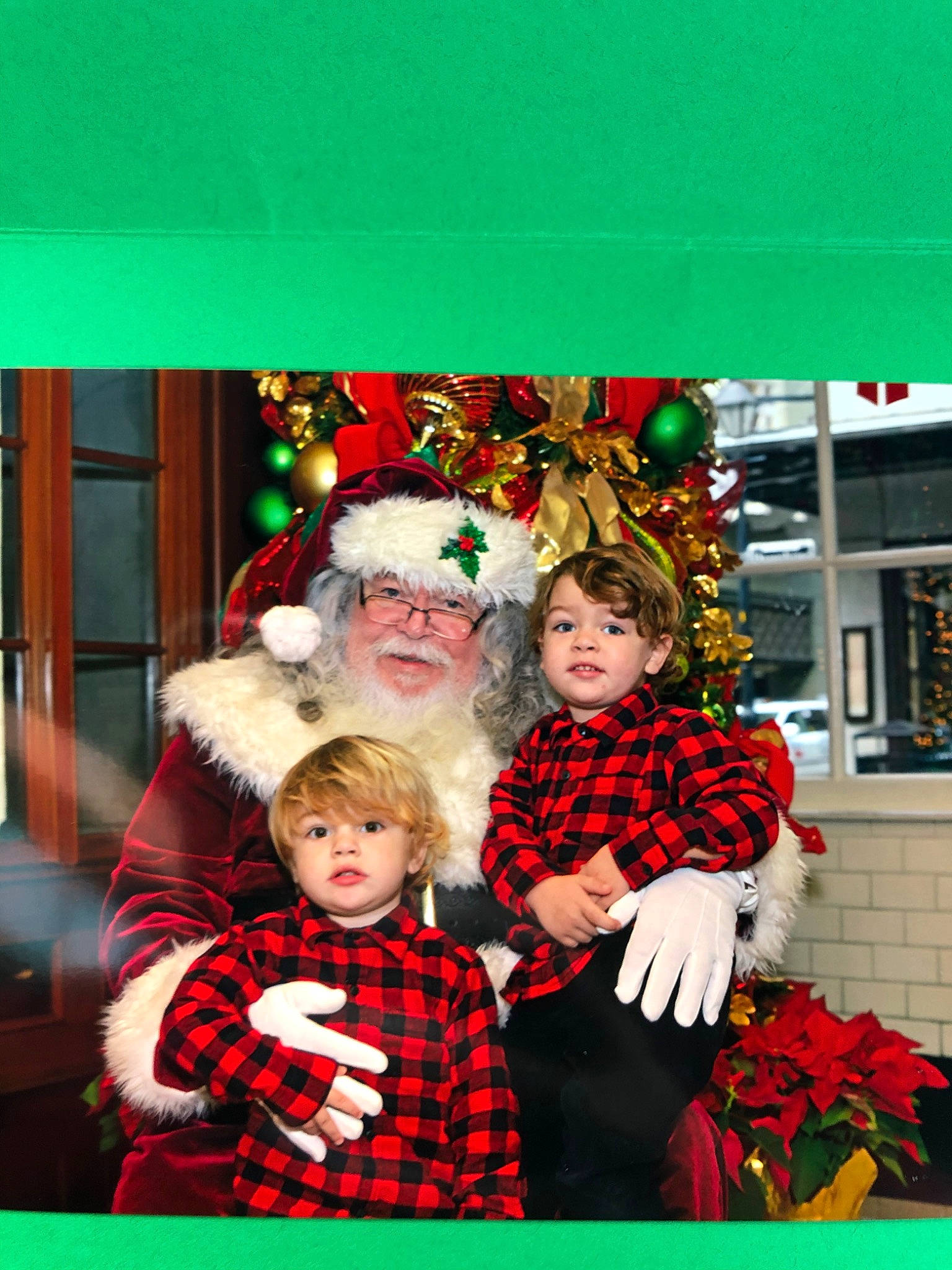 Brandon is registered to the contest to win money with this photo: christmas, christmas_decoration, christmas_eve, christmas_ornament, christmas_tree, event, fictional_character, happy, holiday, lap, person, photography, santa_claus