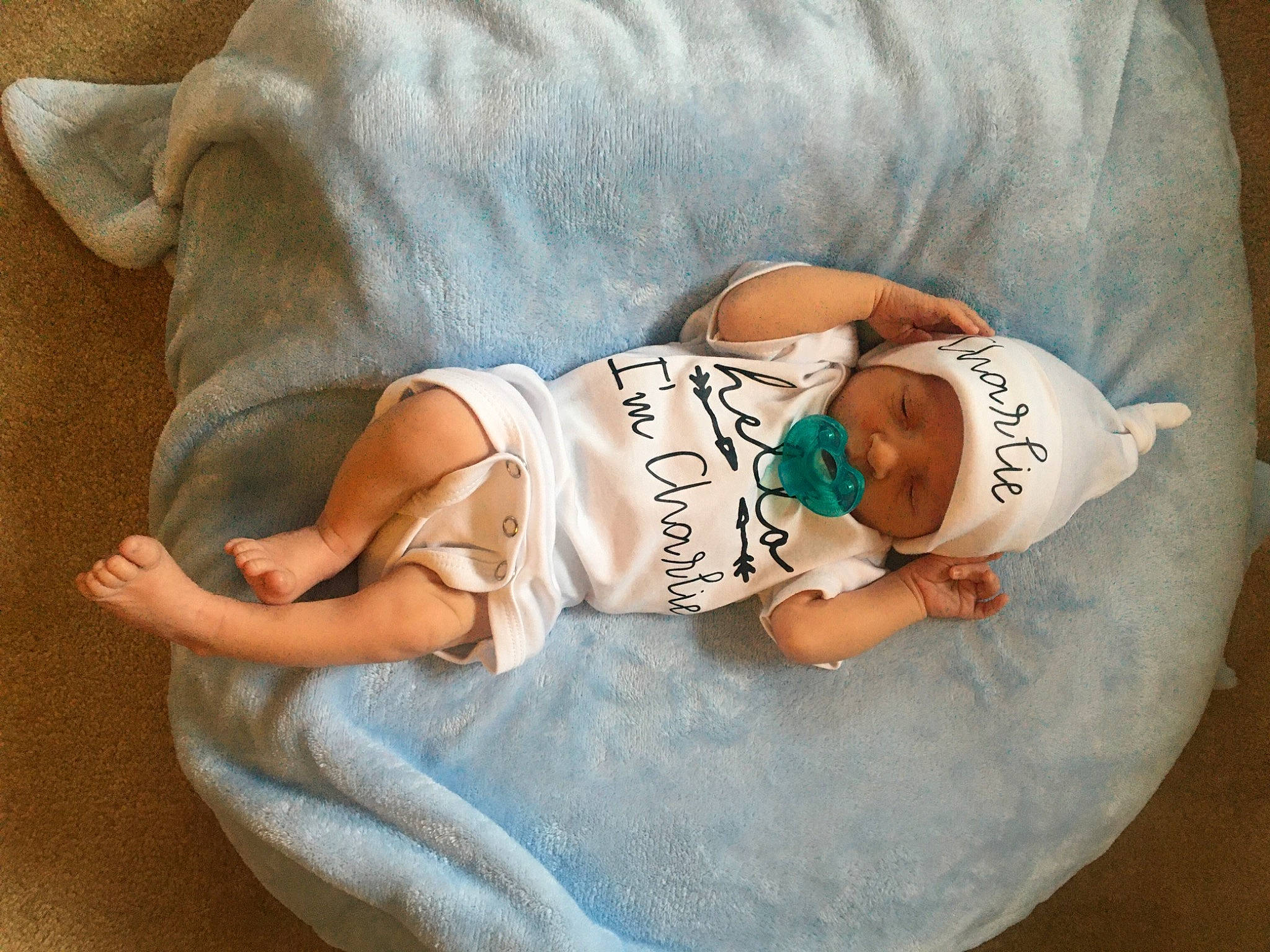Charlie joined the competition — help win amazing prizes! baby, baby_sleeping, baby_toddler_clothing, comfort, elbow, eye, finger, glasses, hand, headgear, headwear, human_body, leg, person, skin, sleeve, stomach, t_shirt, textile, thigh