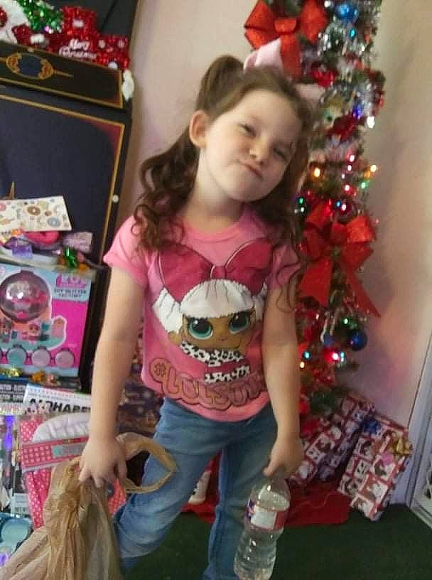 Aubrianna joined the competition — help win amazing prizes! baby_toddler_clothing, christmas_decoration, christmas_ornament, christmas_tree, event, fun, happy, head, holiday, long_hair, magenta, mammal, ornament, person, pink, sleeve, smile, t_shirt, textile, thigh