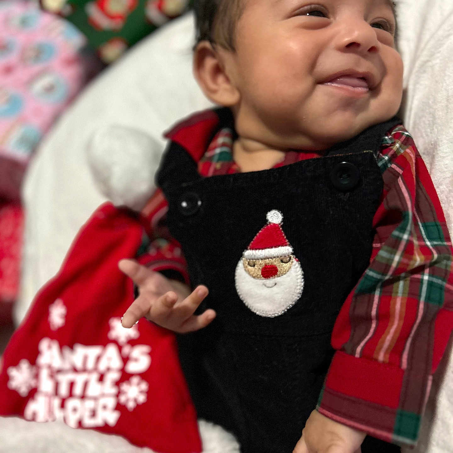 Tadeo is registered to the contest to win money with this photo: baby, blanket, bodypart, clothing, coat, cushion, face, finger, furniture, hand, happy, head, homedecor, jacket, pants, person, photography, portrait, quilt, smile