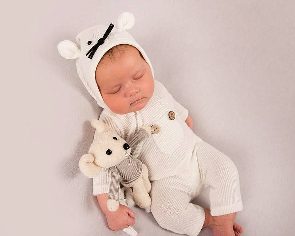 Brooke is registered to the contest to win money with this photo: baby, baby_products, baby_toddler_clothing, carmine, child, comfort, fashion_accessory, fictional_character, finger, fur, gesture, happy, pattern, person, pink, plush, sleeve, stuffed_toy, teddy_bear, toddler