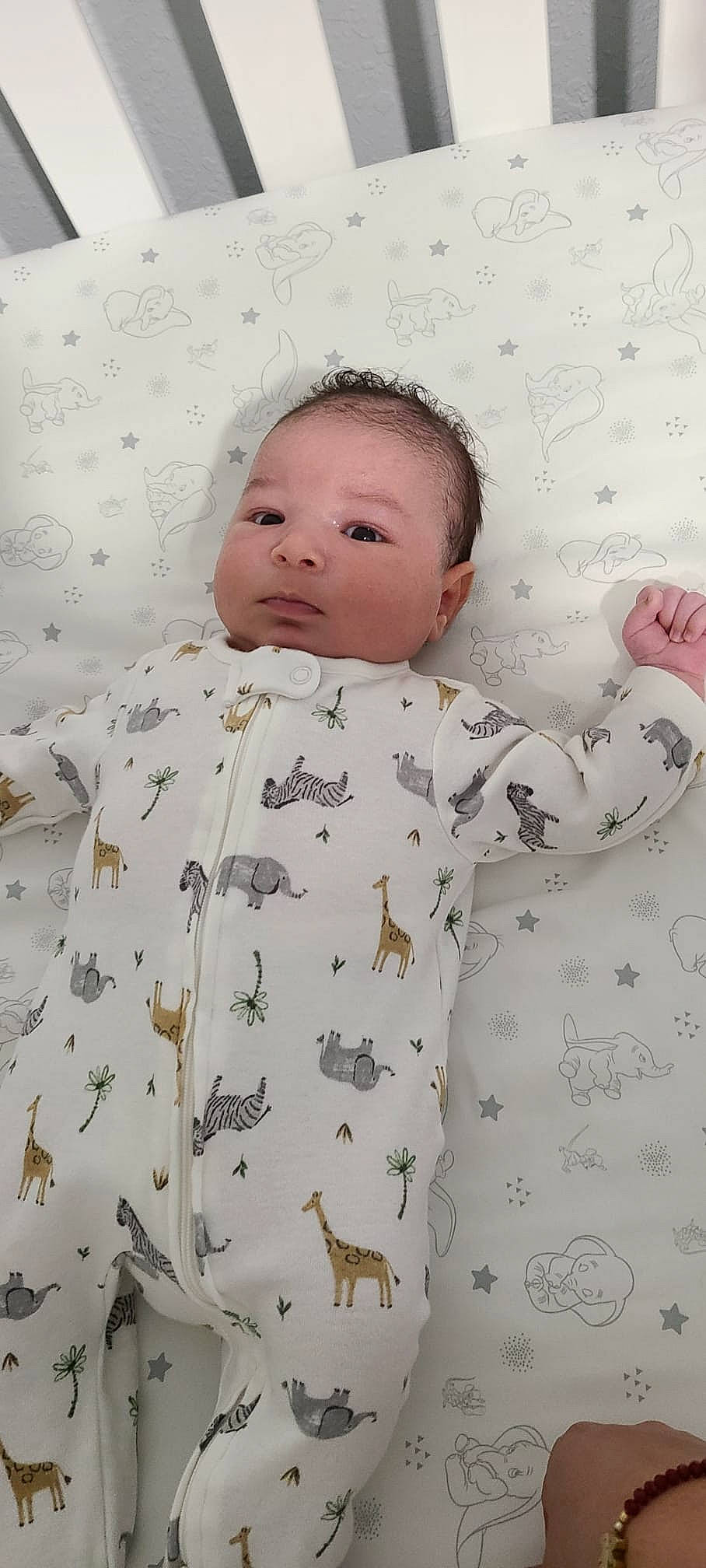 Xian is registered to the contest to win money with this photo: baby, baby_toddler_clothing, cheek, child, comfort, face, facial_expression, gesture, head, linens, nose, pattern, people, person, pink, product, skin, sleeve, textile, toddler