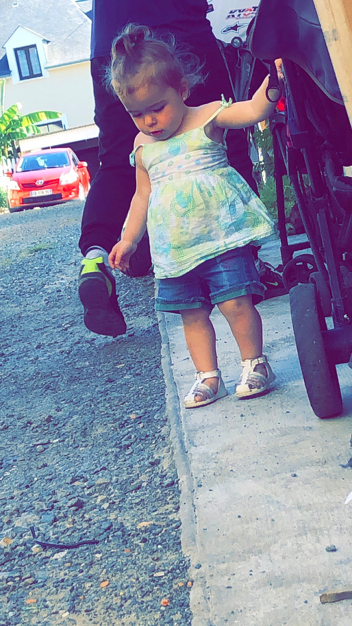 Tessa participe au concours pour gagner de l'argent avec cette photo : asphalt, blue, car, cool, dress, fun, happy, land_vehicle, leisure, person, sandal, shoulder, sneakers, street_fashion, textile, thigh, tints_and_shades, tire, toddler, travel