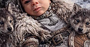 Maxamus is registered to the contest to win money with this photo: baby, child, viking, helmet, fur_cloak, armor, wolf_pups, snow, winter, outdoor, portrait, costume, helmet_with_horns, shield, axe, fur, cute, animal, nature, young_child