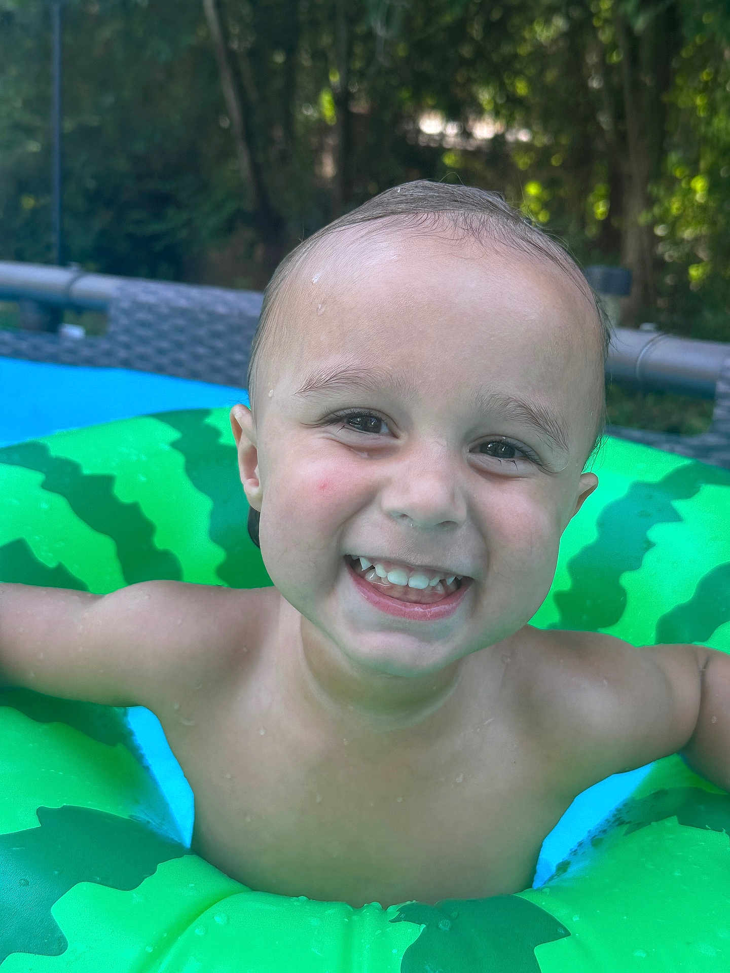 Ej. joined the competition — help win amazing prizes! toddler, child, smiling, water, pool, floatie, green, watermelon, outdoor, summer, happy, skin, face, teeth, head, nature, trees, play, fun, vacation