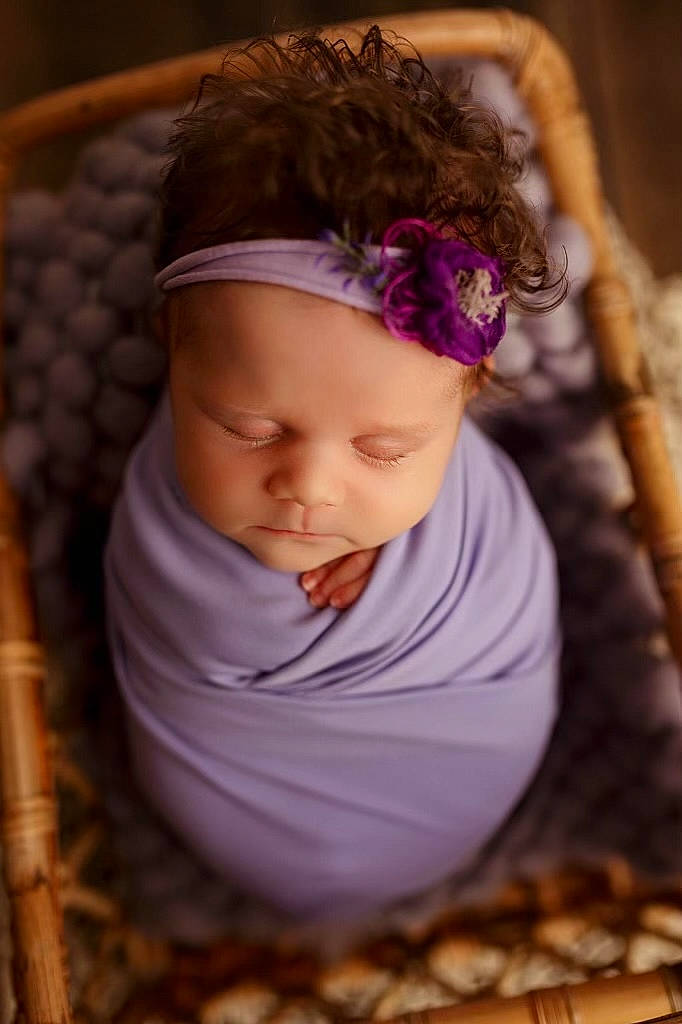 Leilani is registered to the contest to win money with this photo: baby, baby_products, baby_toddler_clothing, beanie, cap, child, eye, face, fashion_accessory, fun, grass, happy, headband, headpiece, leaf, lip, person, sitting, toddler, tree