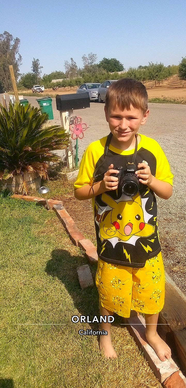 Colt joined the competition — help win amazing prizes! car, child, fun, grass, happy, joy, landscape, leisure, pattern, person, personal_protective_equipment, plant, sky, sleeve, smile, t_shirt, tire, toddler, travel, tree