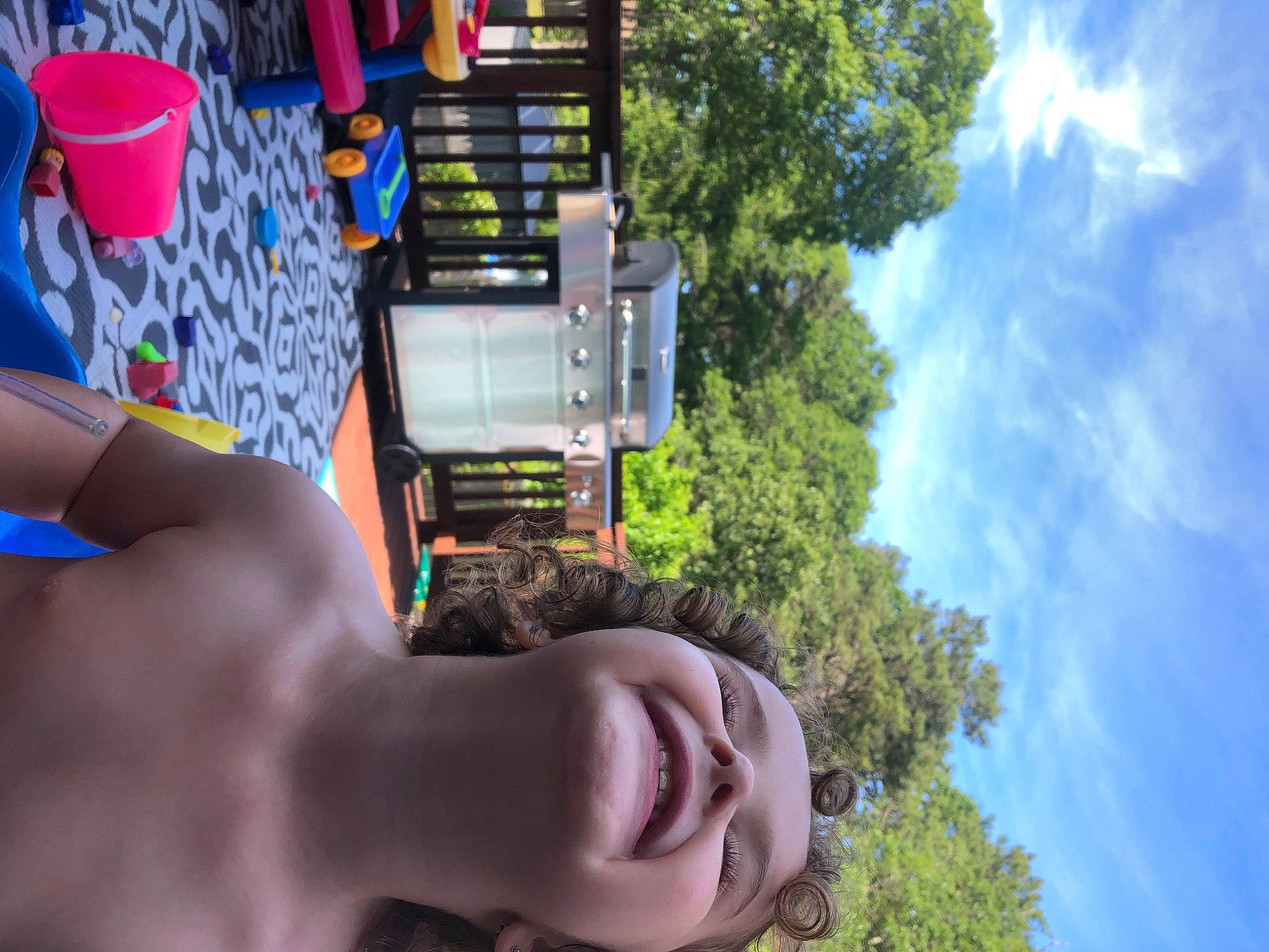 Claire is registered to the contest to win money with this photo: adventure, amusement_ride, barechested, blue, city, cloud, daytime, electric_blue, eyewear, fun, gesture, grass, human_leg, leisure, person, recreation, rock, sky, summer, tree