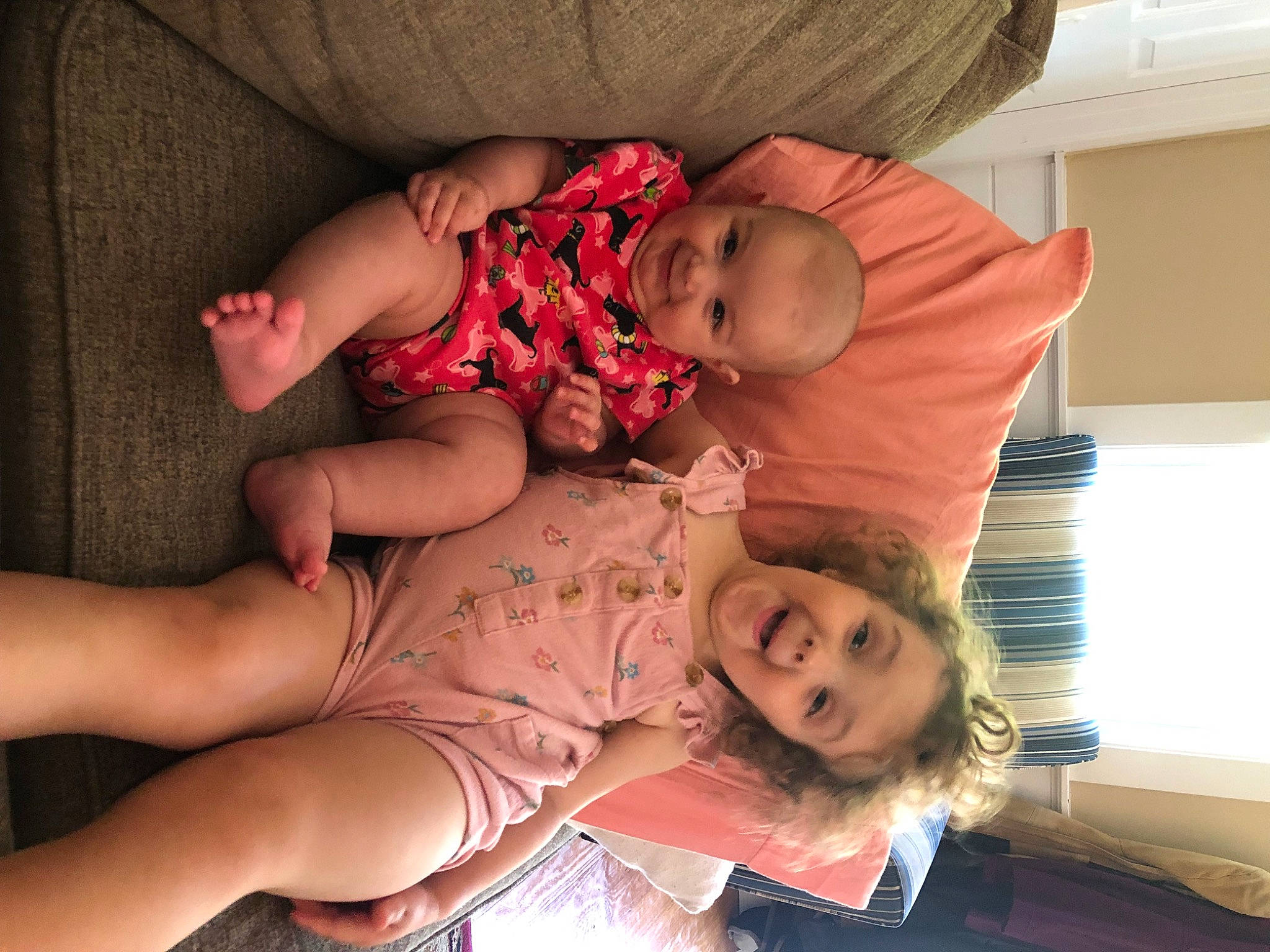 Claire is registered to the contest to win money with this photo: abdomen, baby, chest, child, comfort, finger, fun, happy, hat, human_leg, joy, lap, leg, mouth, person, pink, sitting, skin, smile, surprise