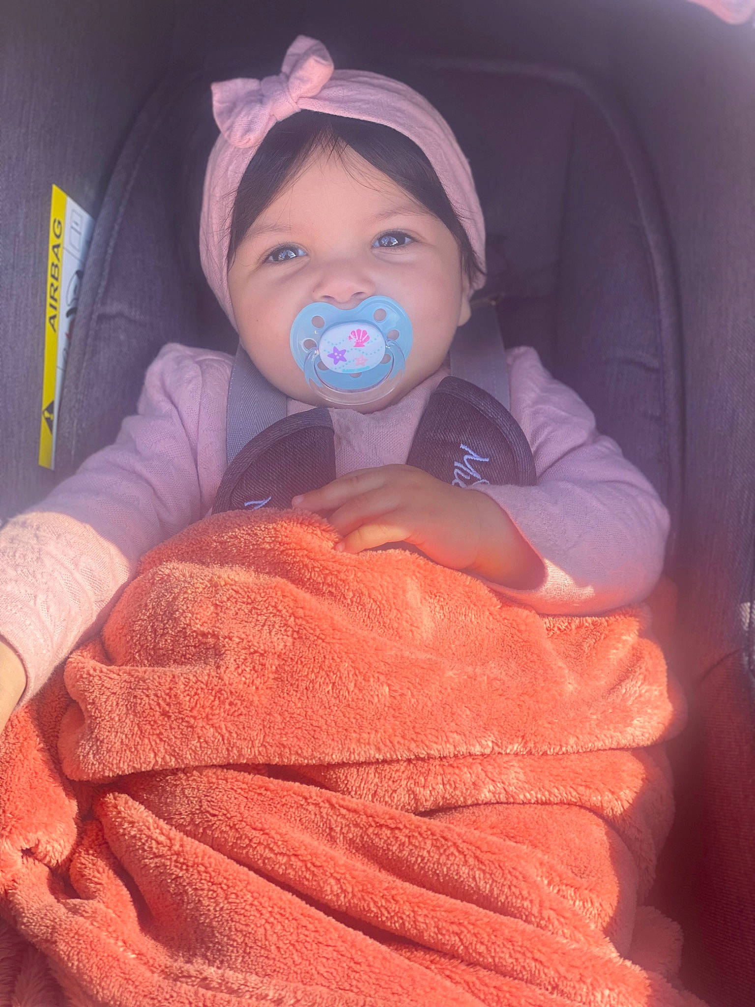 Lana participe au concours pour gagner de l'argent avec cette photo : baby, baby_carriage, baby_products, baby_toddler_clothing, cheek, chin, comfort, eyebrow, finger, headwear, human_body, iris, lip, mouth, nose, outerwear, person, pink, skin, textile