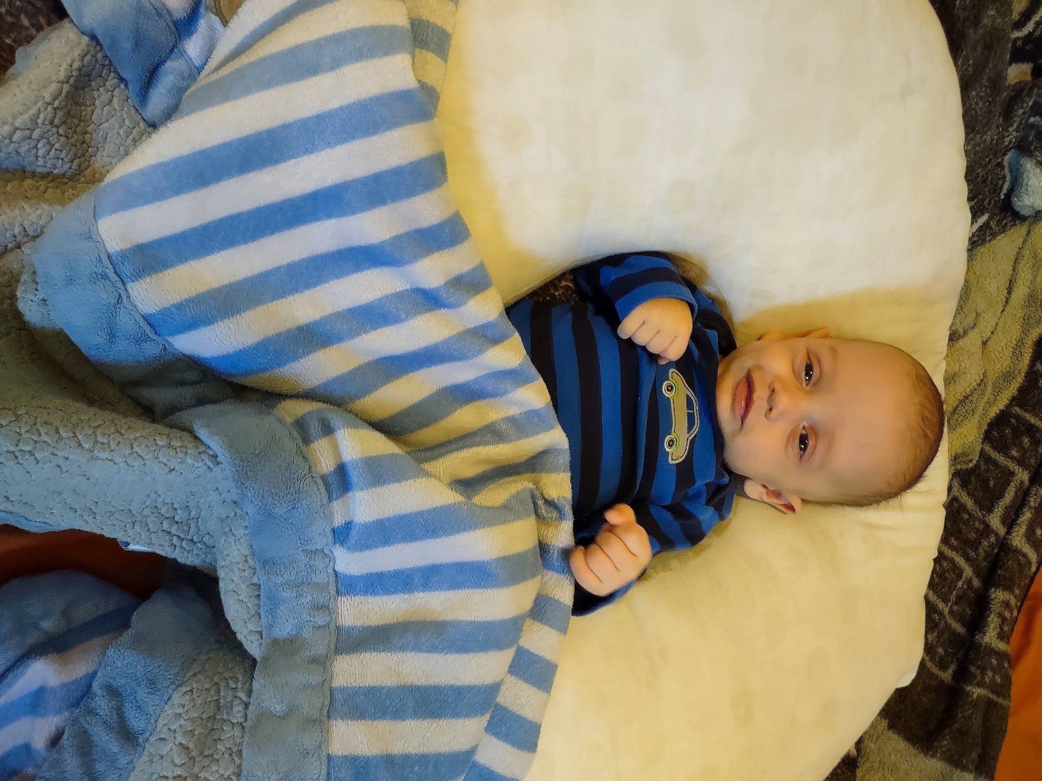 Miguel Saldivar joined the competition — help win amazing prizes! baby, baby_products, baby_safety, baby_sleeping, baby_toddler_clothing, bedtime, cheek, child, comfort, couch, electric_blue, grass, infant_bed, linens, pattern, person, room, sitting, toddler, tree