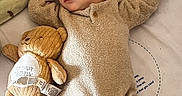 Odin is registered to the contest to win money with this photo: adorable, baby, bed, blanket, child, comfort, cozy, cute, hat, indoors, infant, onesie, peaceful, plush_toy, resting, sleeping, soft, teddy_bear, toy, warm