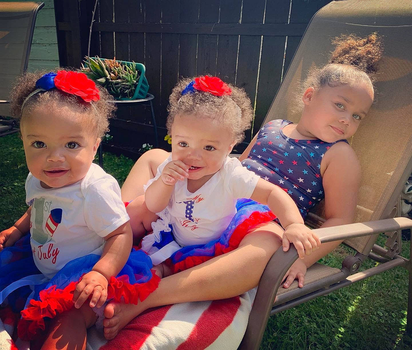 Milani is registered to the contest to win money with this photo: baby, baby_products, baby_toddler_clothing, chair, child, event, fun, grass, happy, headband, lap, leisure, person, play, recreation, sitting, skin, smile, snapshot, toddler