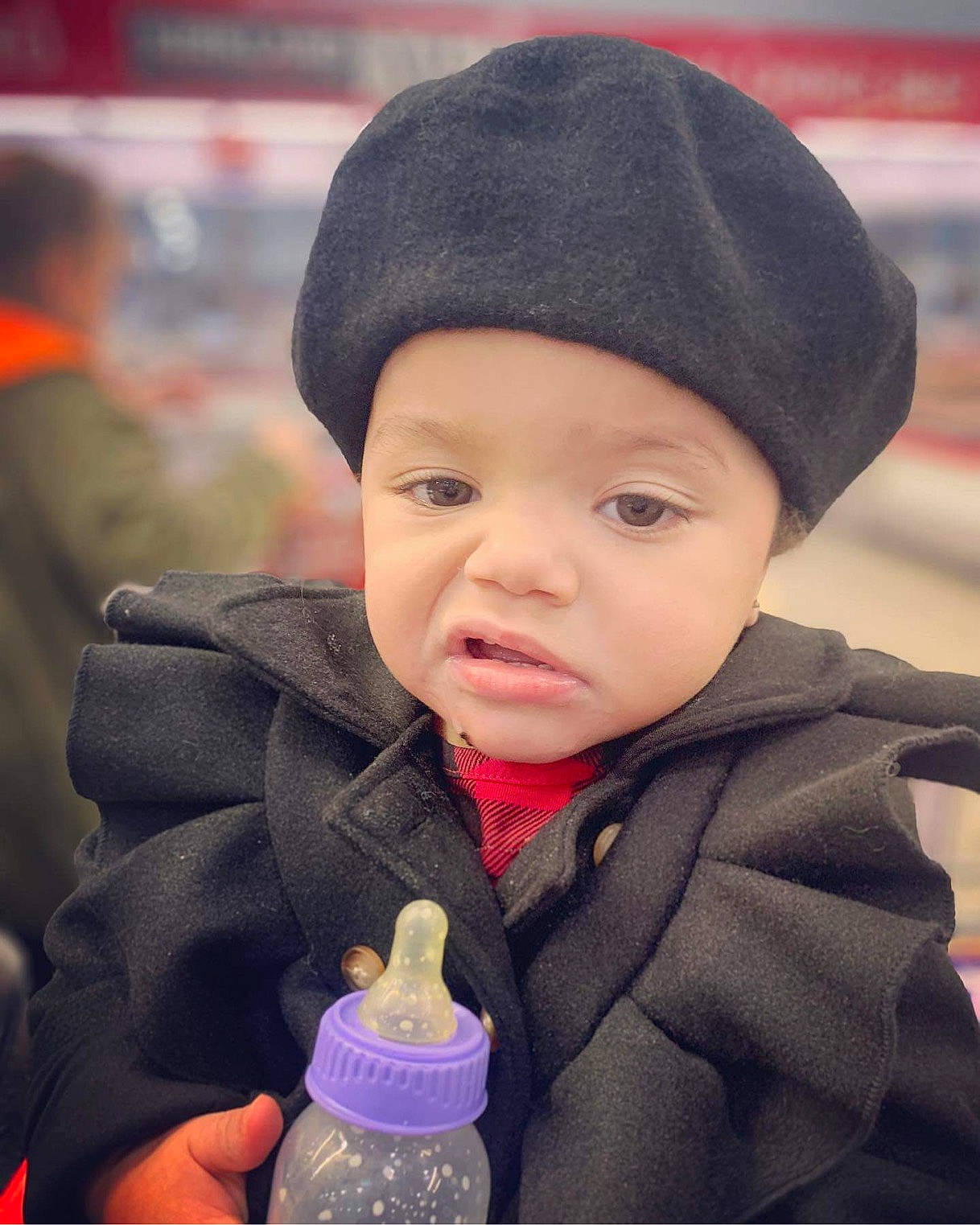 Maliyah is registered to the contest to win money with this photo: beauty, bottle, cap, cheek, child, clothing, cloud, cool, happy, headwear, jacket, knit_cap, lip, organ, outerwear, person, plastic_bottle, product, skin, toddler