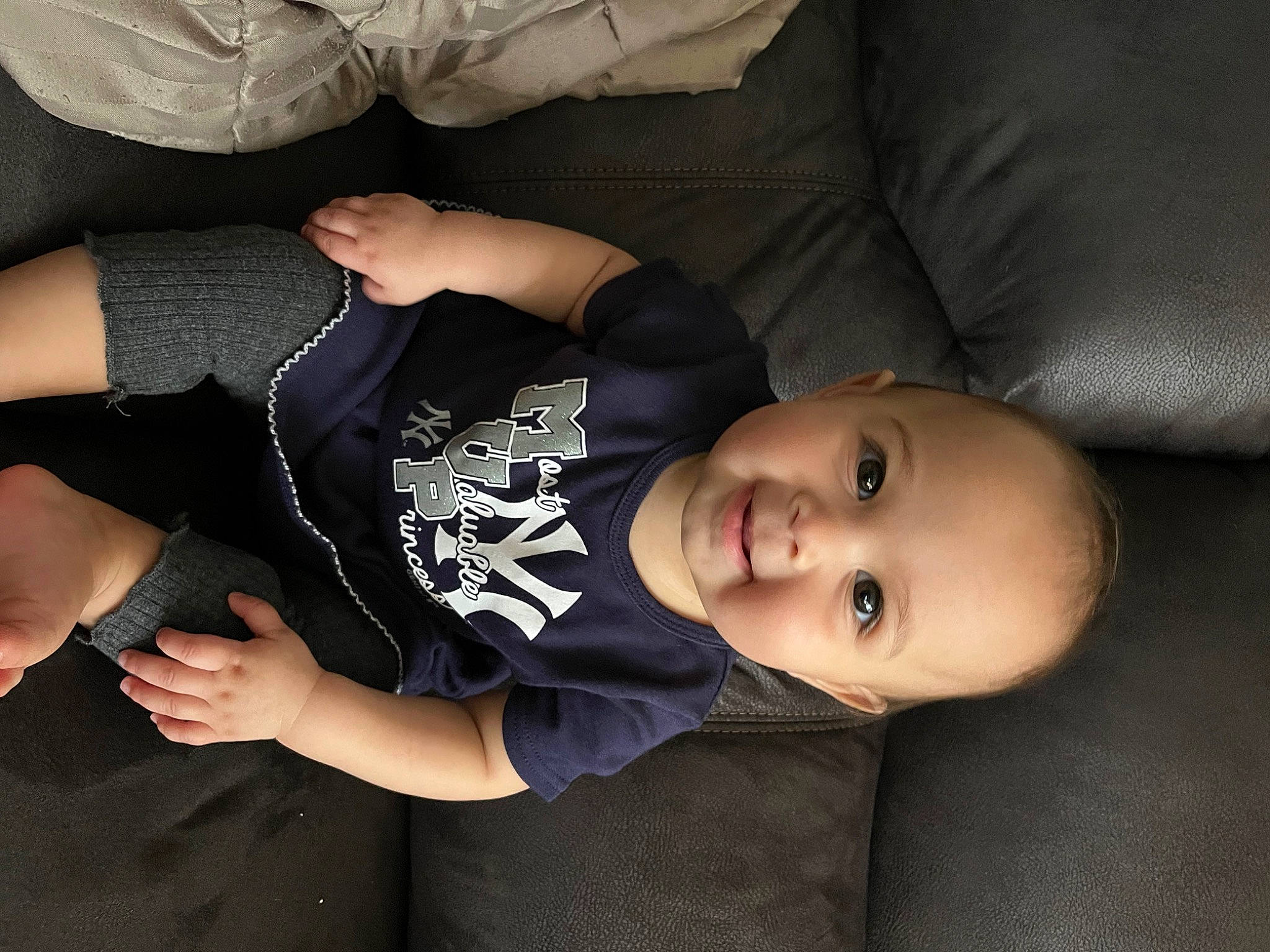 Adriana is registered to the contest to win money with this photo: arm, black_hair, cheek, comfort, cool, elbow, facial_expression, finger, flash_photography, gesture, hairstyle, hand, human_body, joy, knee, leg, person, skin, sleeve, smile