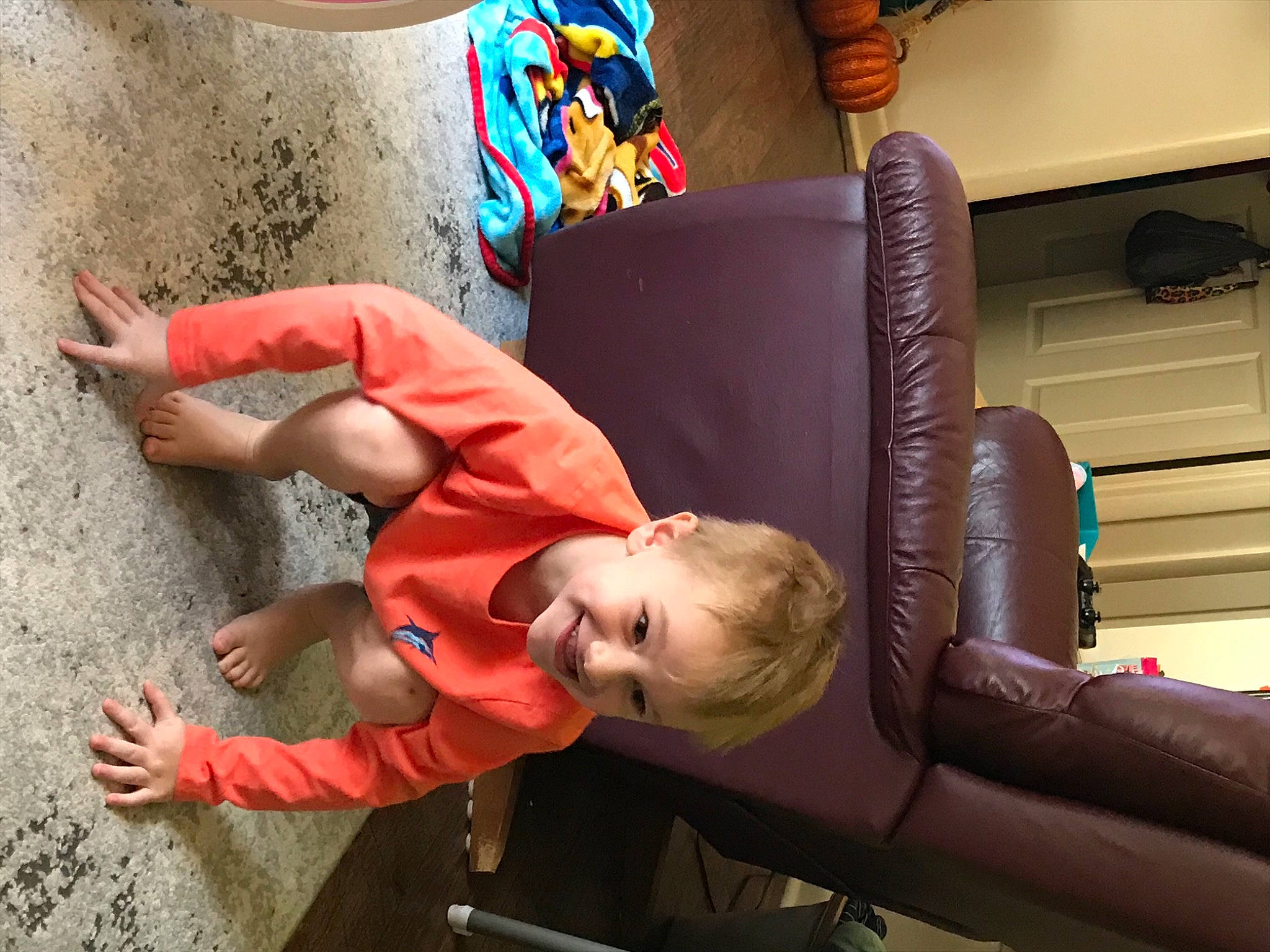Gunner joined the competition — help win amazing prizes! armrest, baby, comfort, ear, head, human, joint, joy, living_room, person, play, shelf, toddler