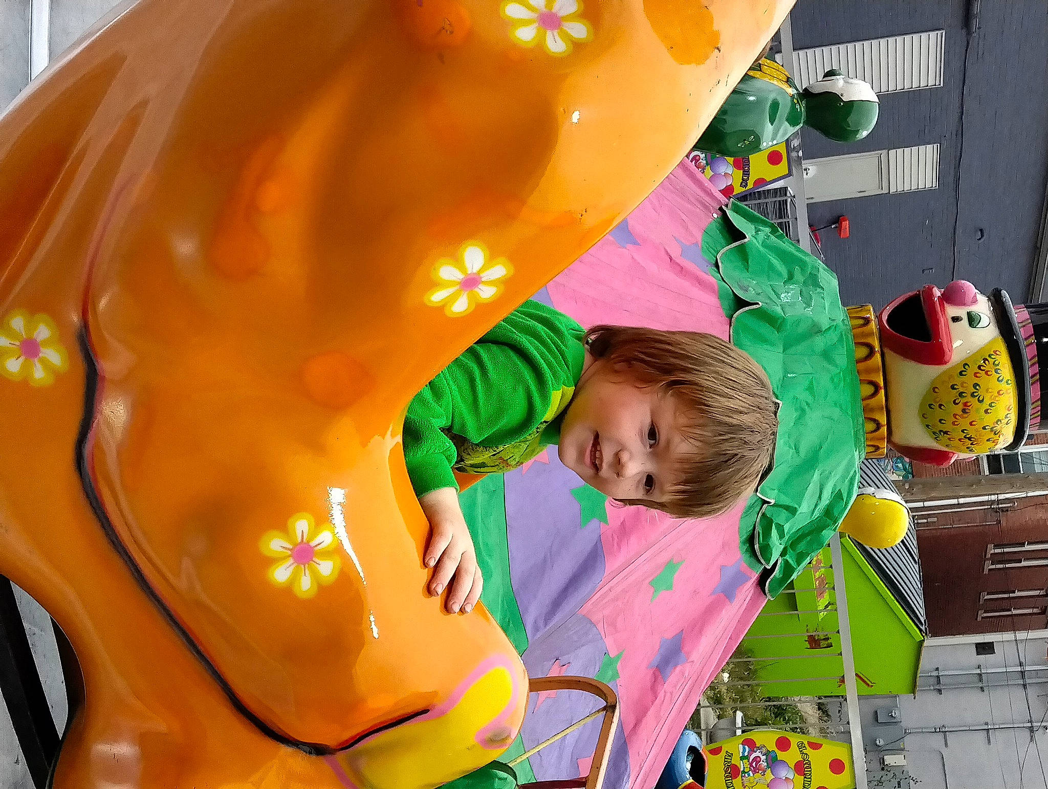 Ashton is registered to the contest to win money with this photo: amusement_ride, baby, cabinetry, child, chute, city, event, fun, games, green, happy, inflatable, leisure, outdoor_play_equipment, person, plastic, play, playground, recreation, toddler