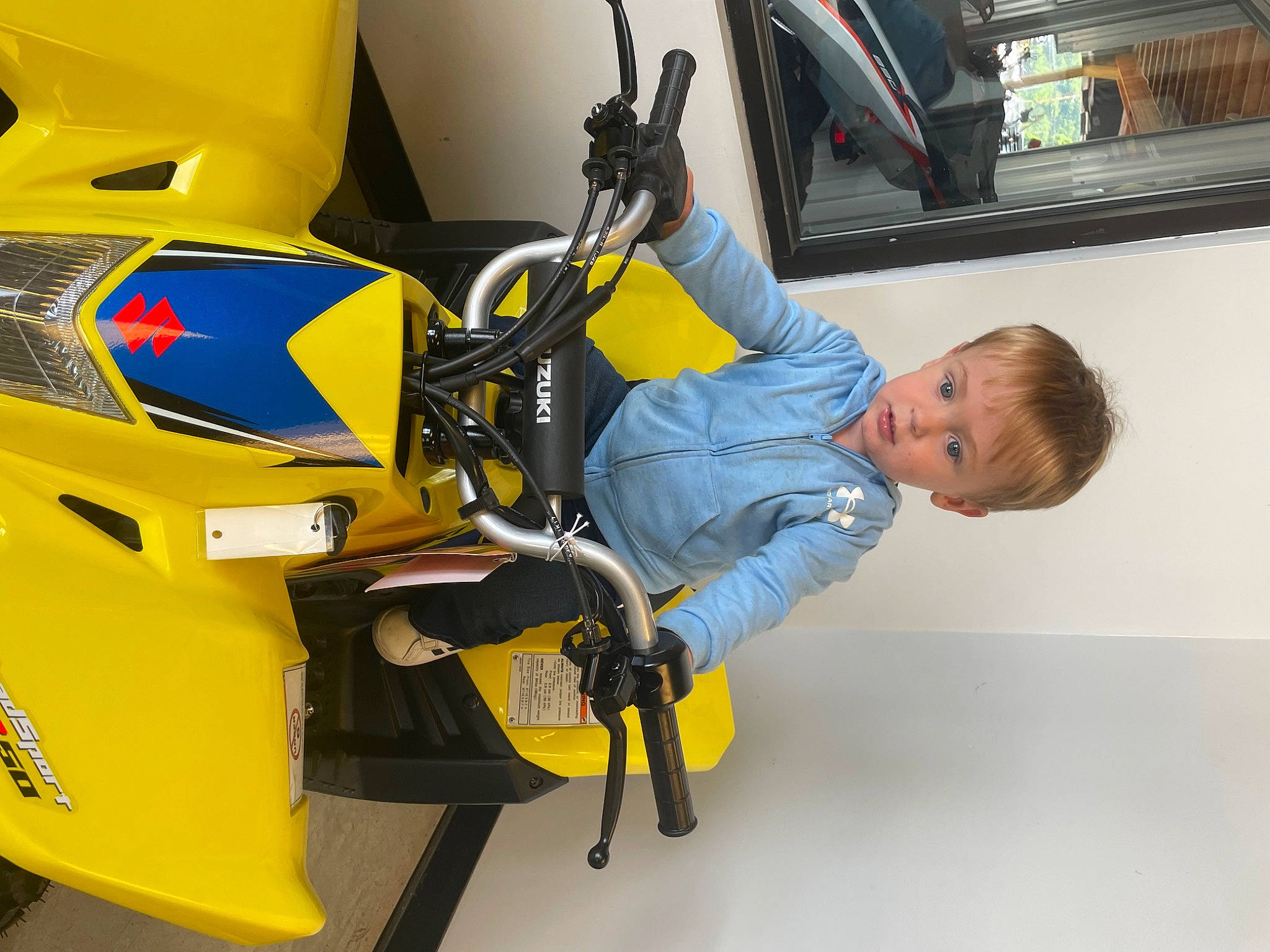 Dawson is registered to the contest to win money with this photo: auto_part, automotive_design, automotive_exterior, automotive_lighting, automotive_tire, automotive_wheel_system, electric_blue, engineering, fender, luggage_and_bags, machine, motor_vehicle, person, personal_protective_equipment, rim, service, tire, vehicle, vehicle_door, wheel