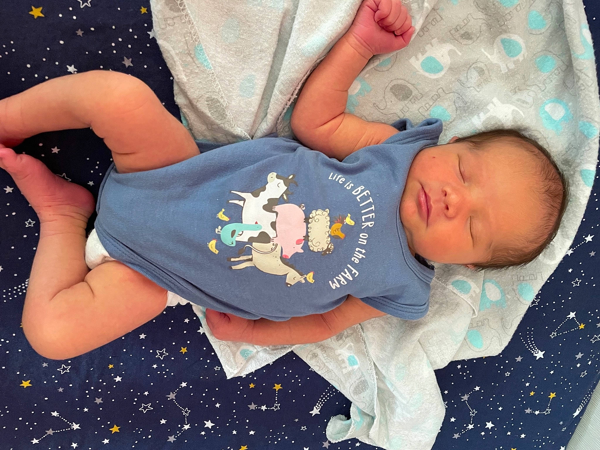 Craig is registered to the contest to win money with this photo: baby, baby_sleeping, baby_toddler_clothing, comfort, elbow, facial_expression, gesture, happy, human, human_body, human_leg, leg, pattern, person, product, sleeve, t_shirt, textile, thigh, toddler