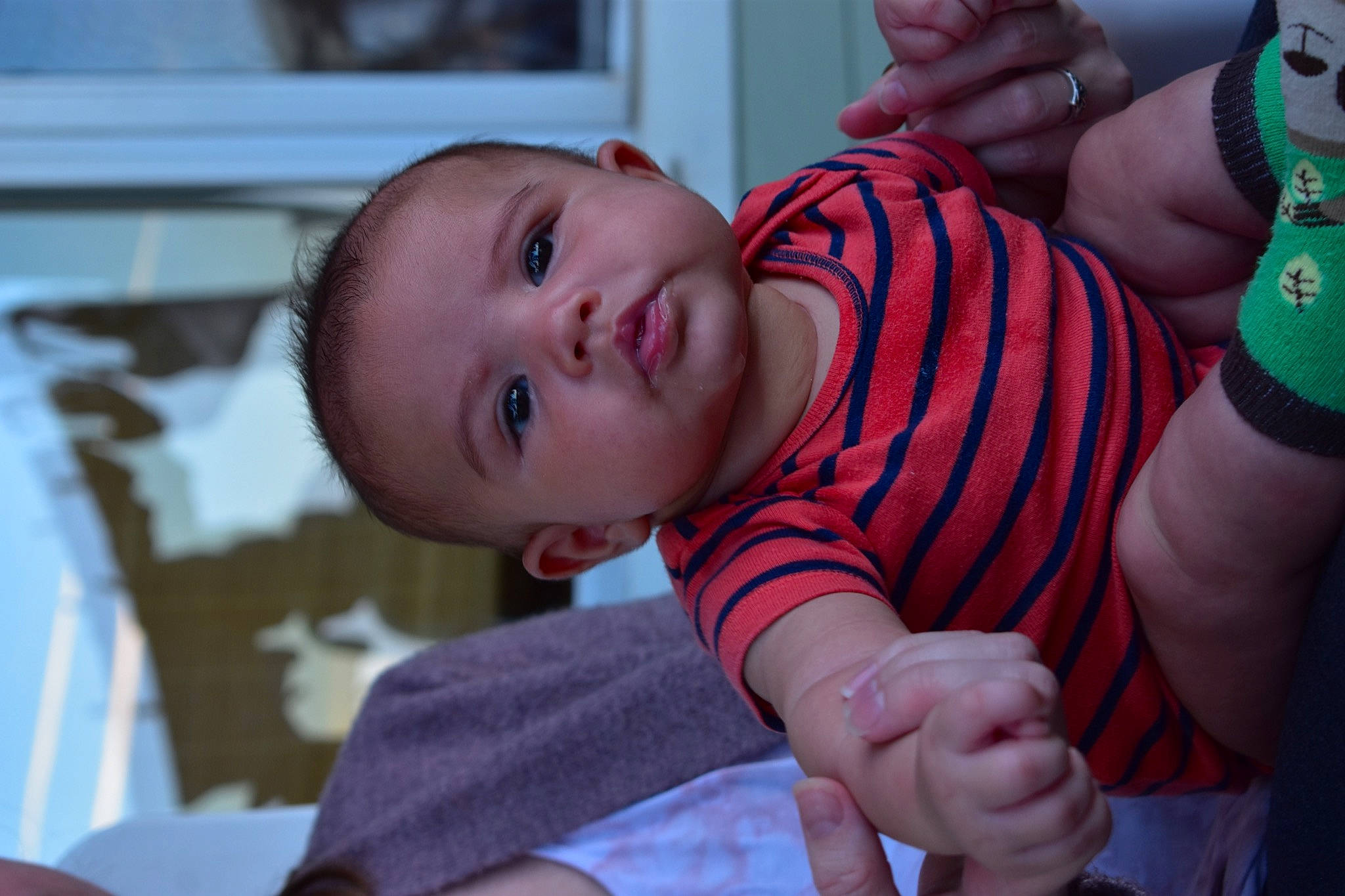 Craig is registered to the contest to win money with this photo: arm, baby, baby_toddler_clothing, cheek, clothing, finger, fun, gesture, hand, happy, human_body, iris, joint, lip, mouth, nose, person, skin, sleeve, smile