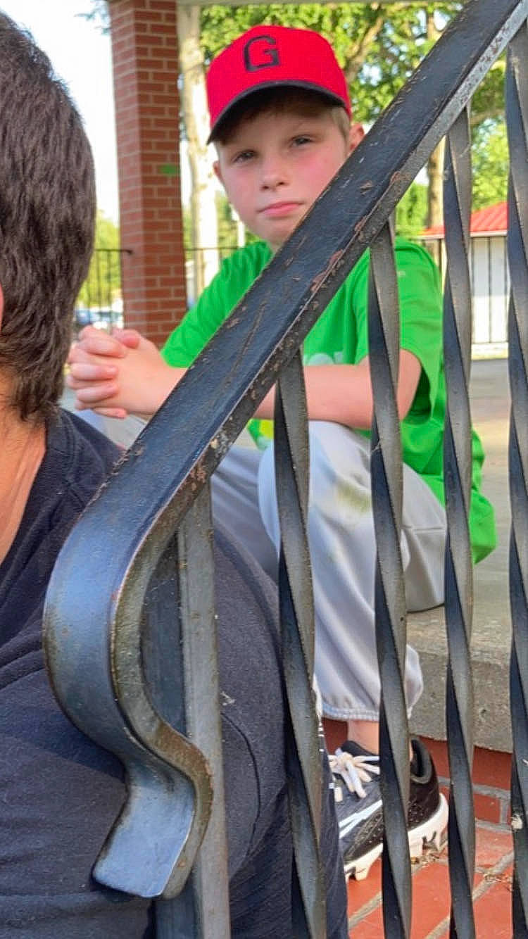 Skyler is registered to the contest to win money with this photo: burmese_python, cap, child, costume, event, fun, handrail, hat, headwear, leisure, person, python, recreation, t_shirt, toddler, tree, vacation, wood