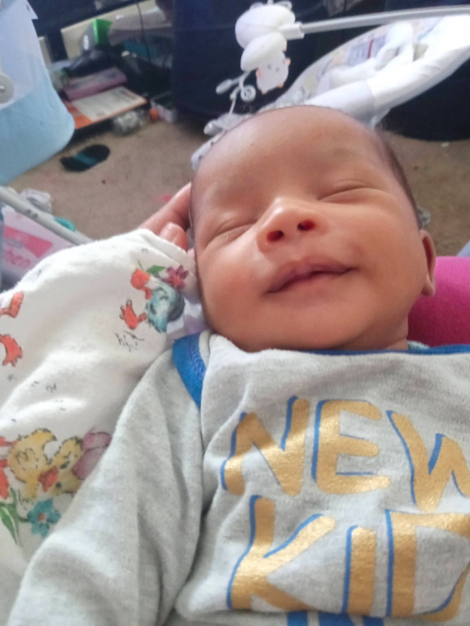 Derrick is registered to the contest to win money with this photo: baby, baby_toddler_clothing, cheek, child, chin, comfort, event, eye, eyebrow, face, grass, happy, iris, linens, mouth, person, skin, smile, textile, toddler