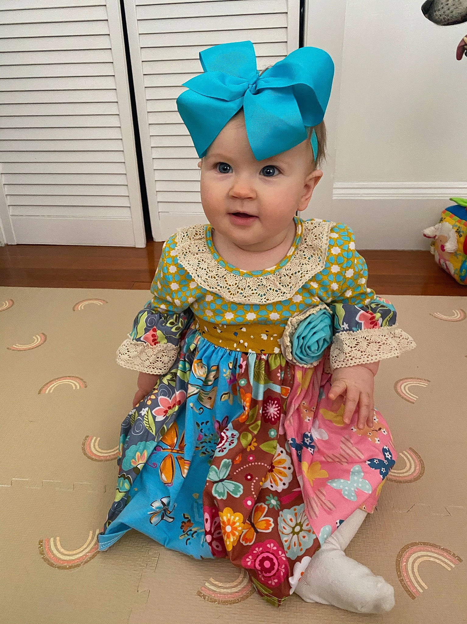 Collins is registered to the contest to win money with this photo: baby, baby_toddler_clothing, blue, child, costume, door, event, face, fashion_accessory, flooring, fun, happy, head, headpiece, headwear, magenta, pattern, person, pink, room