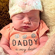 Cassadee joined the competition — help win amazing prizes! baby, newborn, sleeping, infant, hat, clothing, blanket, soft, cute, peaceful, face, person, portrait, cozy, pink, floral, apparel, child, resting, toddler