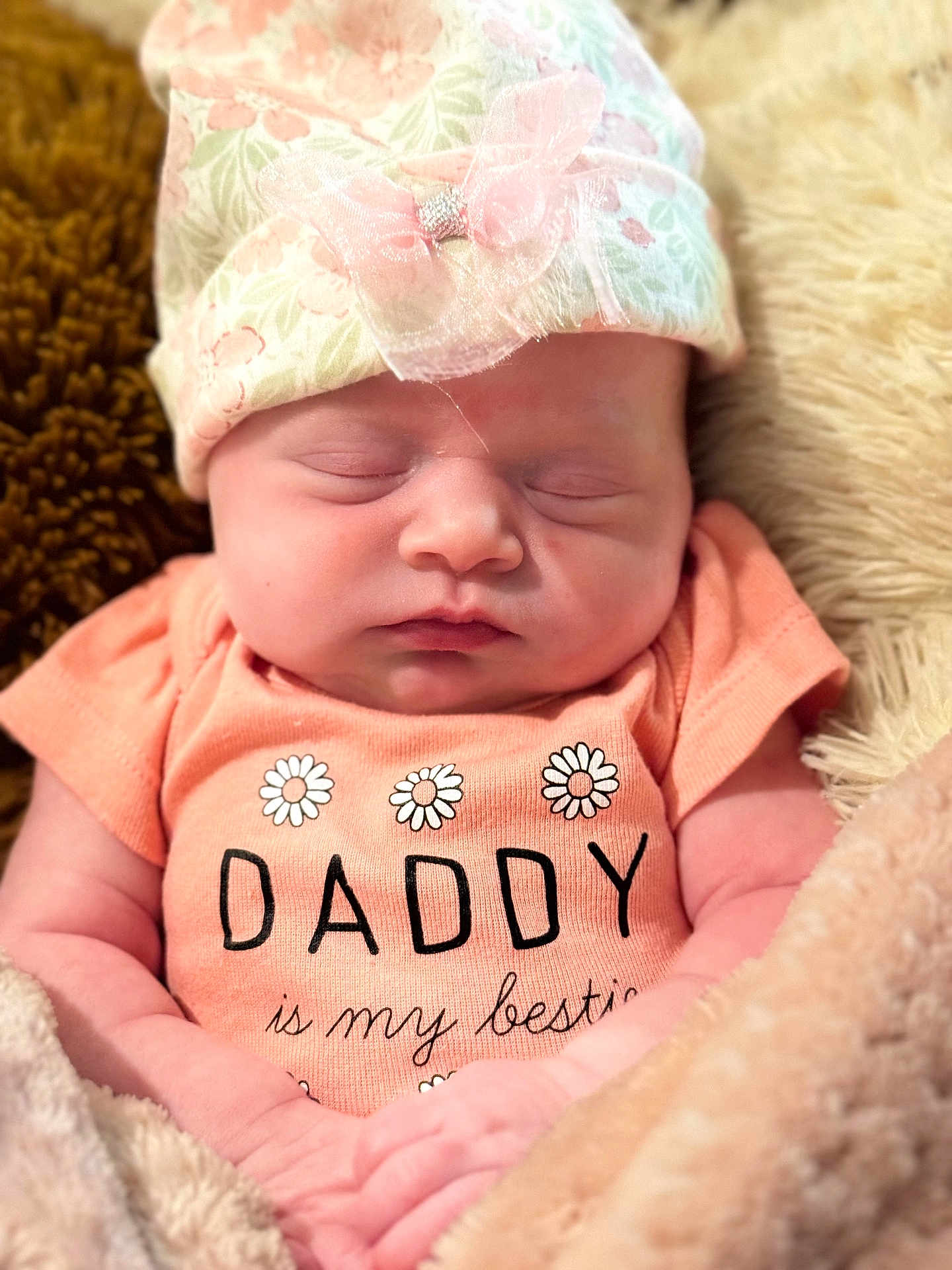 Cassadee joined the competition — help win amazing prizes! baby, newborn, sleeping, infant, hat, clothing, blanket, soft, cute, peaceful, face, person, portrait, cozy, pink, floral, apparel, child, resting, toddler