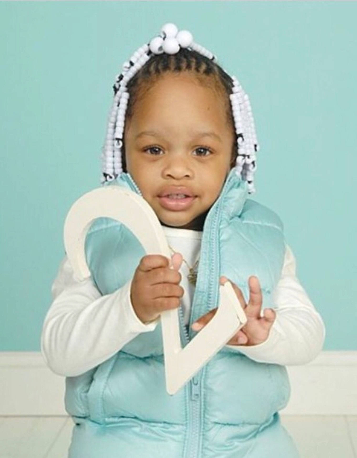 Nicole is registered to the contest to win money with this photo: child, girl, headgear, infant, outerwear, person, product, sleeve, toddler