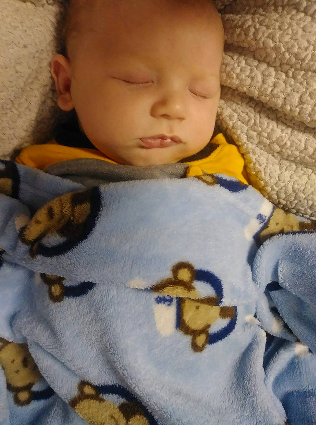 Tyler is registered to the contest to win money with this photo: baby, bedtime, blanket, cheek, child, face, head, nap, nose, person, skin, sleep, toddler