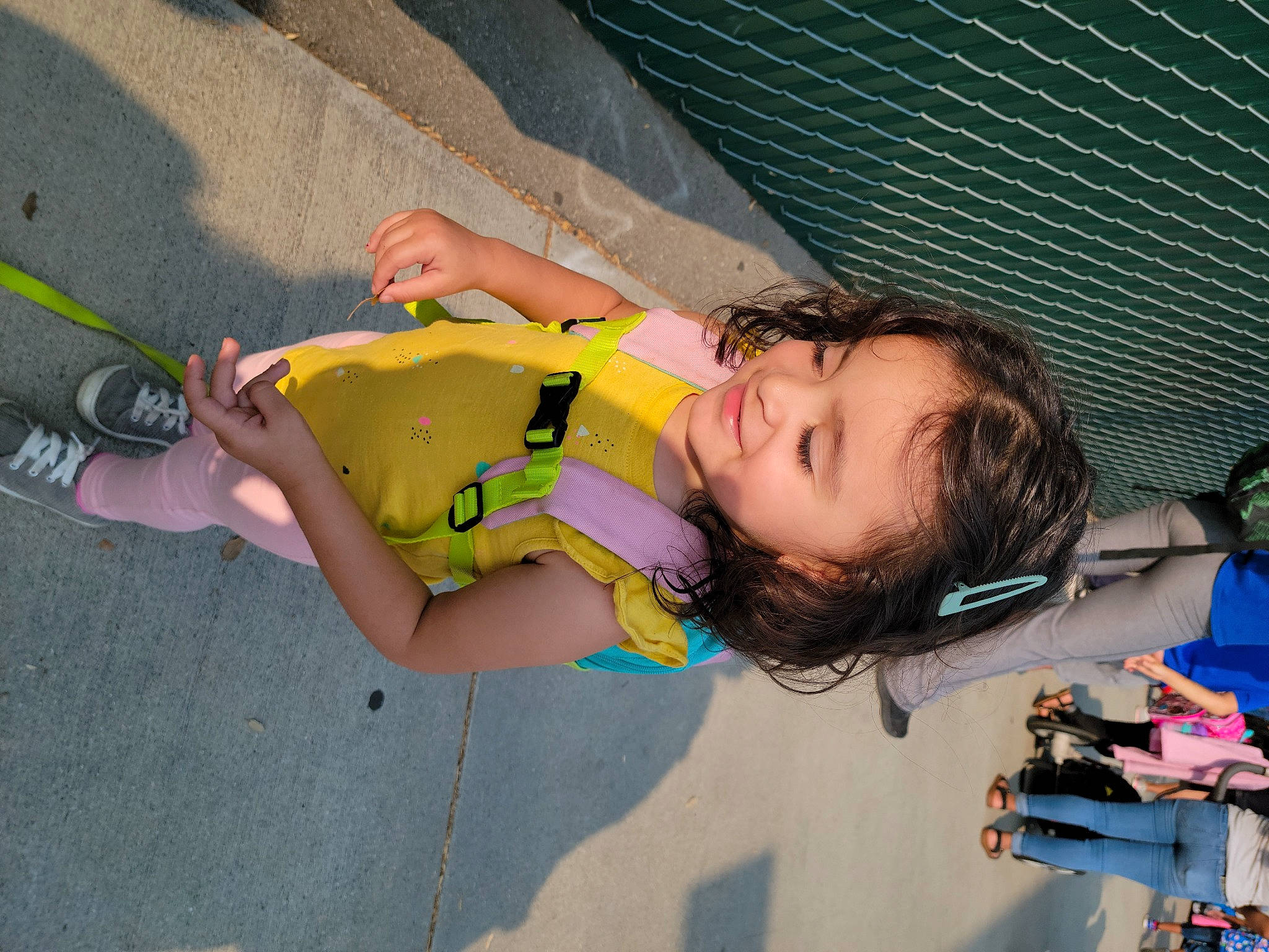 Dayana is registered to the contest to win money with this photo: adventure, asphalt, child, concrete, cool, eyewear, fun, happy, human_leg, joy, knee, leisure, person, personal_protective_equipment, play, recreation, sand, smile, thigh, toddler