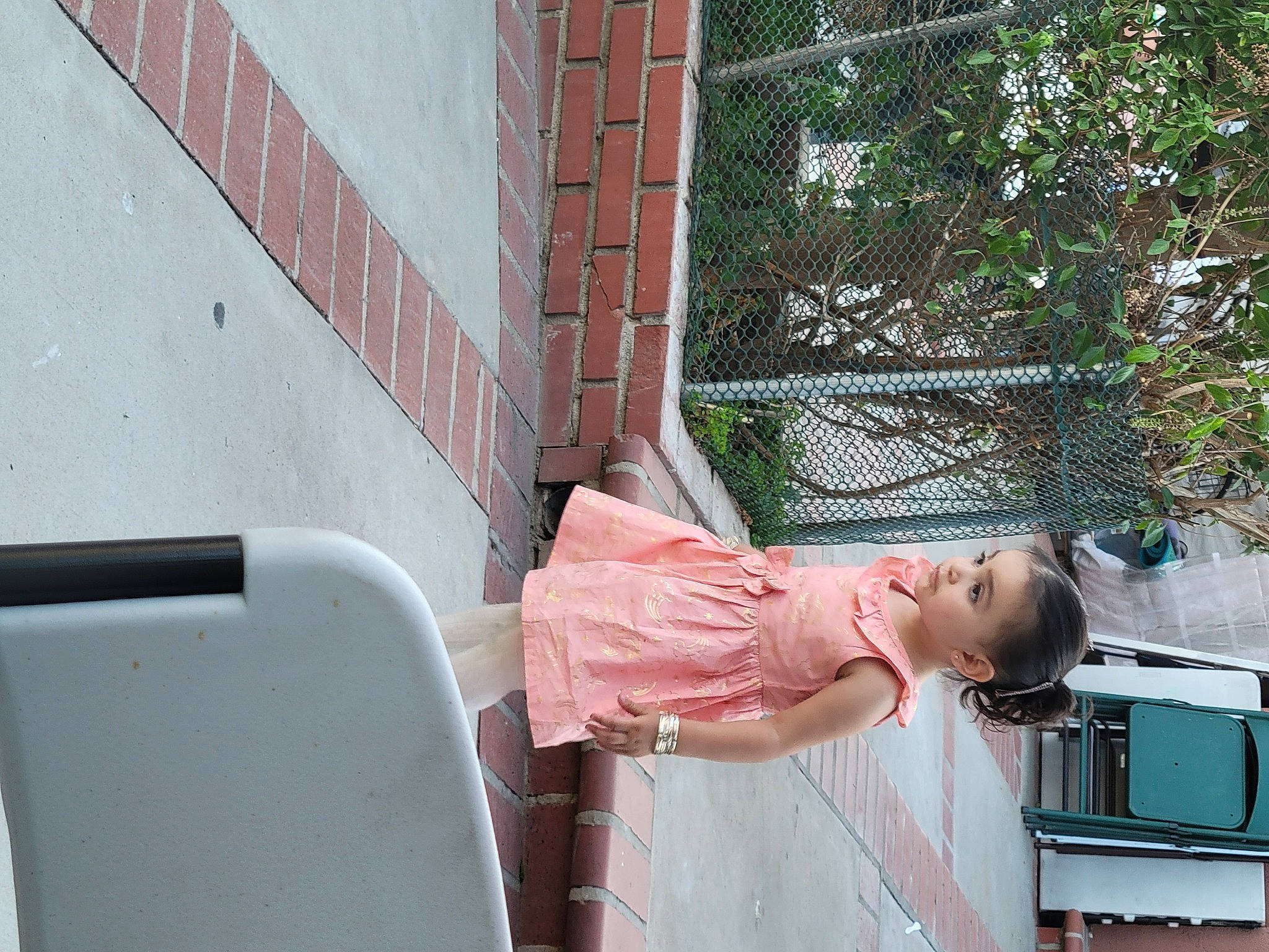 Dayana is registered to the contest to win money with this photo: baby, child, dress, fun, handrail, house, human_leg, leisure, magenta, person, sandal, sitting, street_fashion, thigh, toddler, tree, vehicle_door