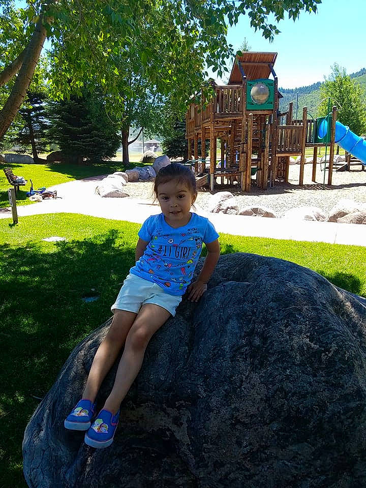 Akira is registered to the contest to win money with this photo: backyard, child, day, fun, girl, grass, green, leisure, outdoor_play_equipment, outdoor_recreation, park, person, plant, play, playground, public_space, recreation, travel, tree, vacation