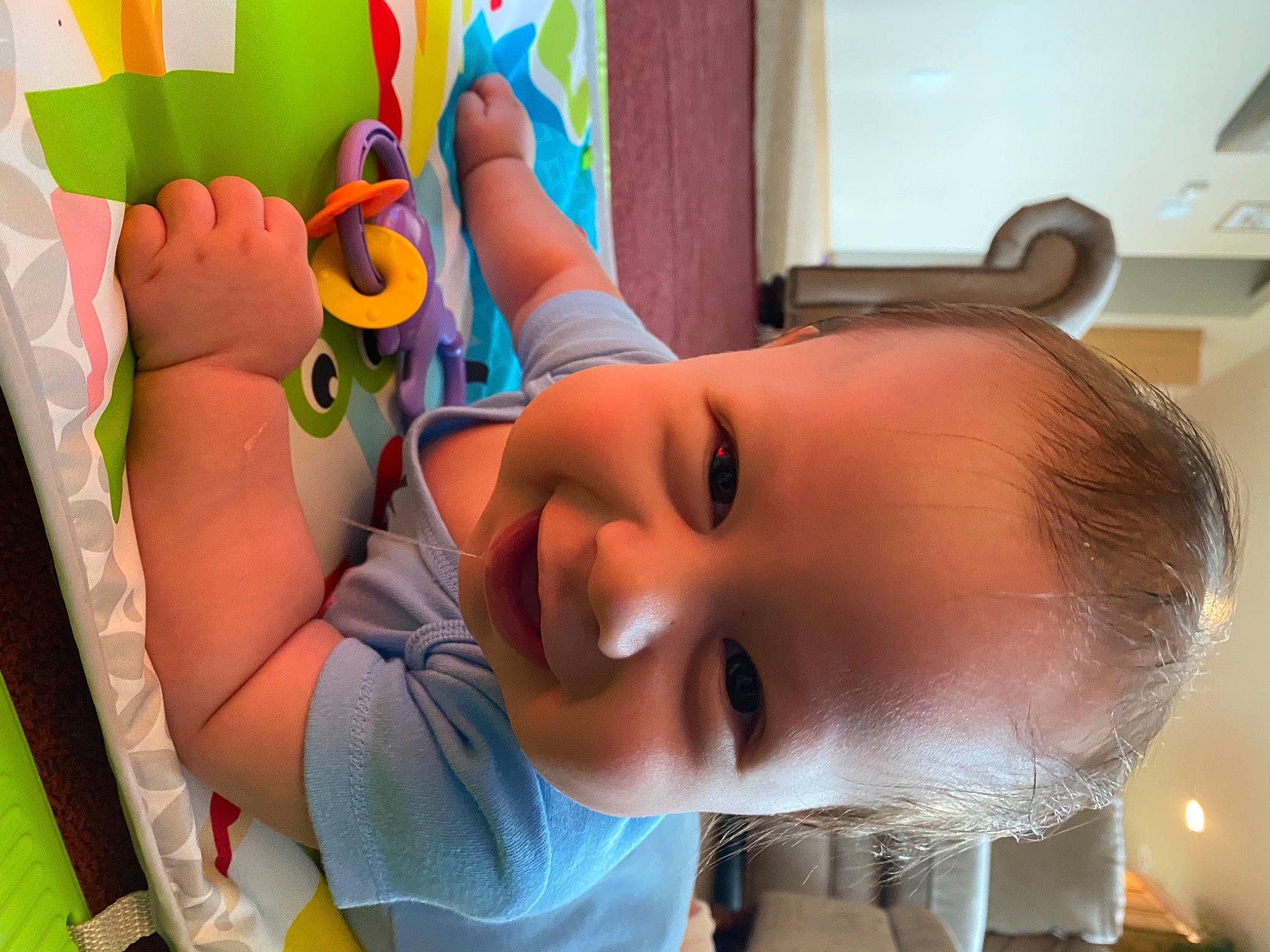 Kaiser is registered to the contest to win money with this photo: baby, baby_toddler_clothing, cheek, ear, eyelash, face, facial_expression, finger, fun, gesture, happy, joy, leisure, mouth, nose, organ, person, skin, smile, textile