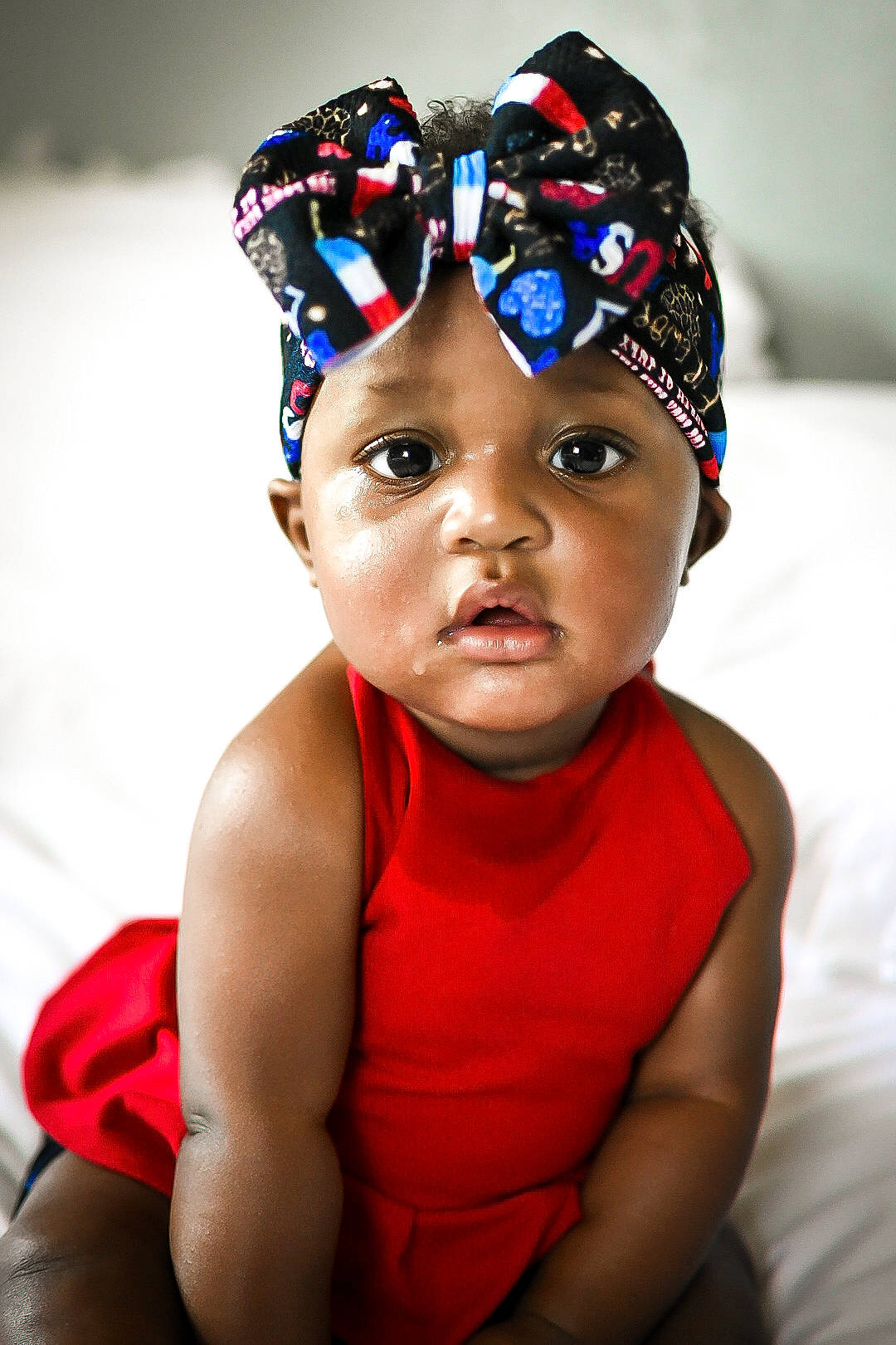 Khloe is registered to the contest to win money with this photo: baby, baby_toddler_clothing, cap, child, electric_blue, eye, eyewear, face, fun, happy, hat, headband, headgear, headpiece, headwear, party_supply, person, personal_protective_equipment, recreation, sports_gear